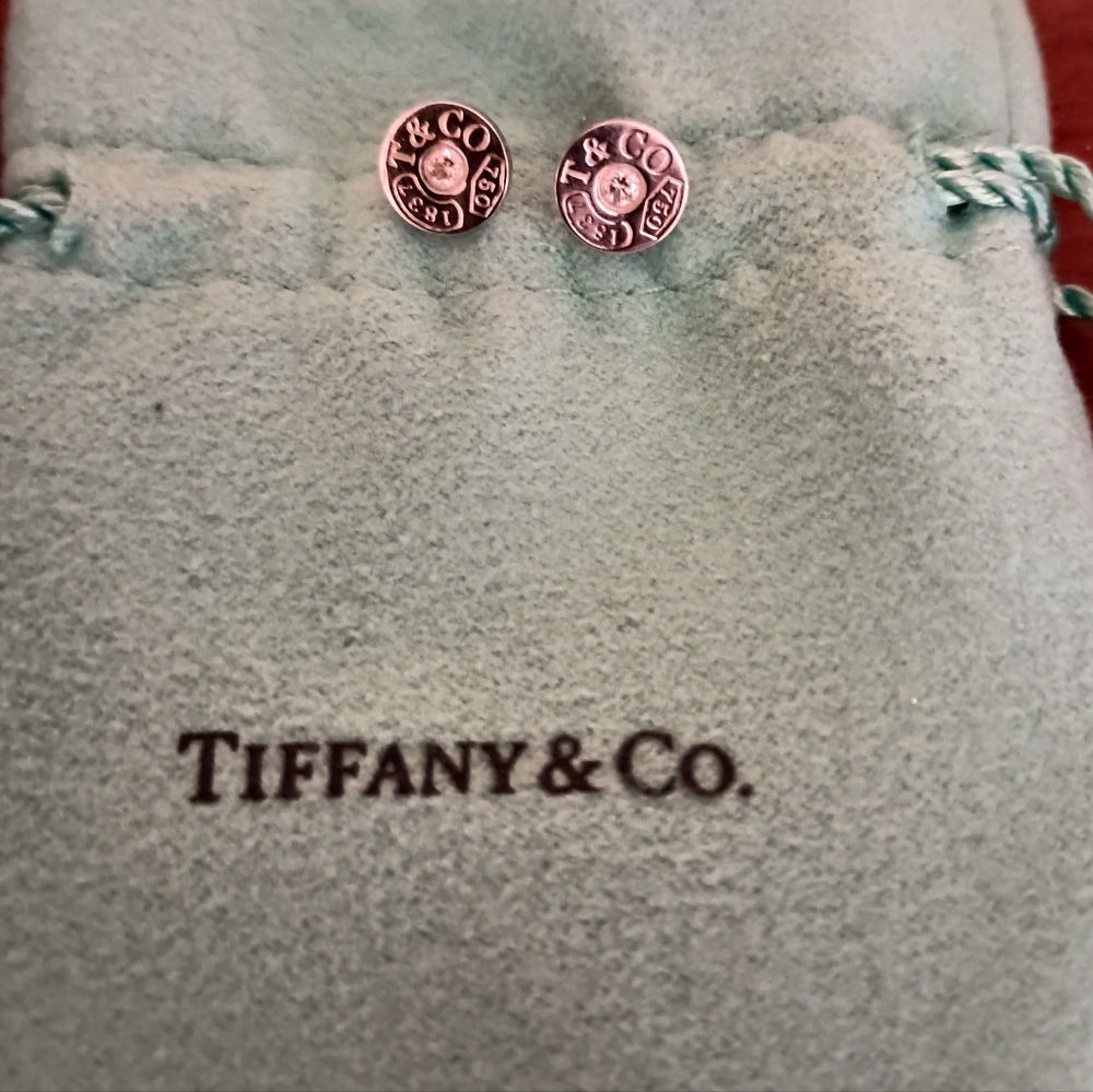 Tiffany's white gold earrings with diamond chip
